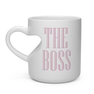Right of ceramic mug with heart shaped handle and pink print of "THE BOSS"